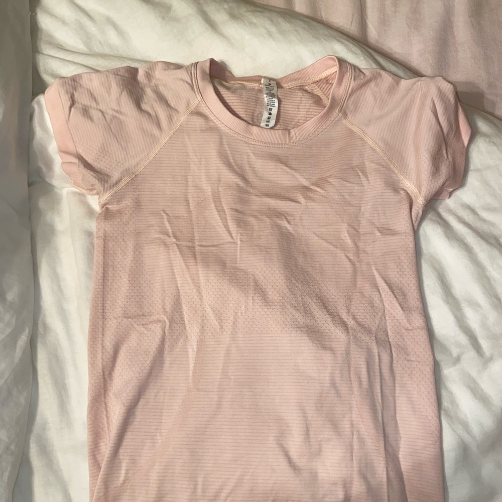 Light pink Lululemon swiftly tech shirt